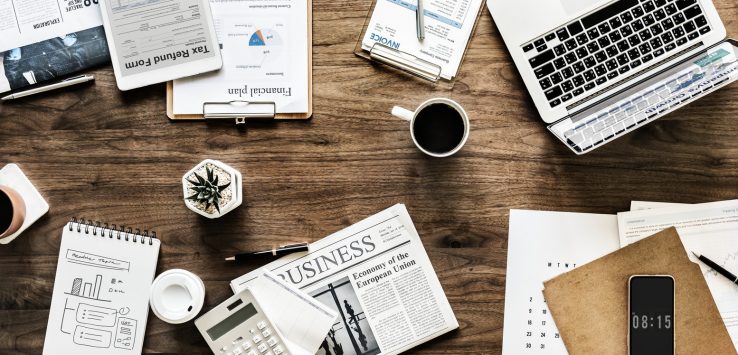 crowded-desk-business-meeting-1-738x355-1 crowded-desk-business-meeting-1-738x355-1